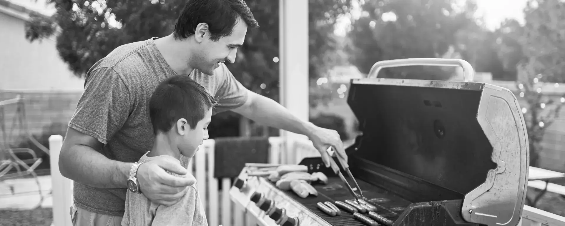 Father and son grilling